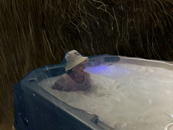 Karen Duquette in the hot tub on a snowy night